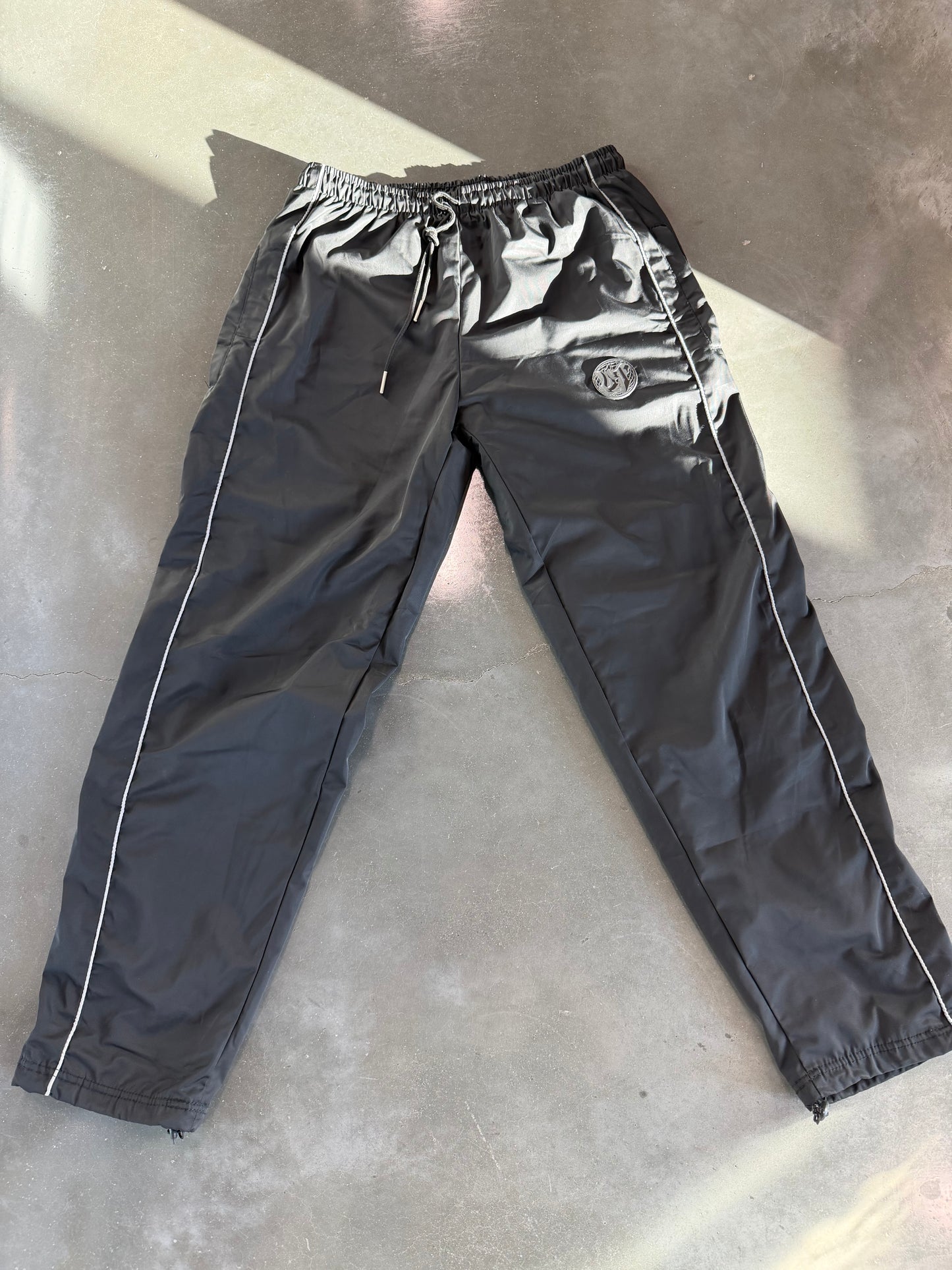 Unknown Truths Black Track Pants (PRESALE)